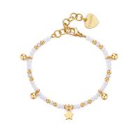 Bracciale dorato serie Glint con sfere bianche e stella