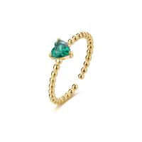 Anello dorato serie Dazzly con cristallo a cuore verde